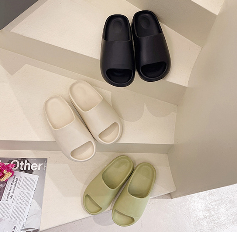 a pair of slippers sitting on top of a white counter