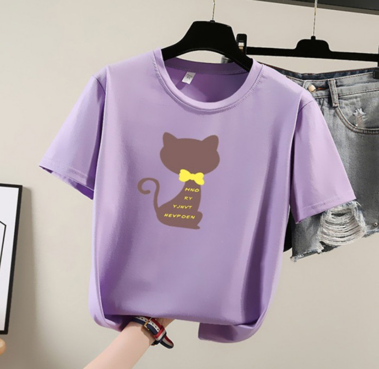 a t - shirt with a cat on it hanging on a clothes rack