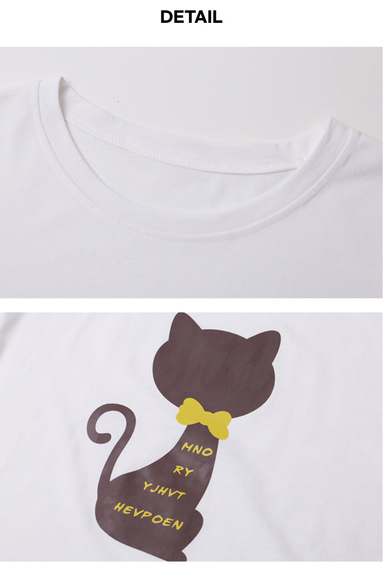 a white t - shirt with a black cat on it