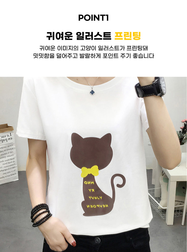 a woman wearing a t - shirt with a cat on it