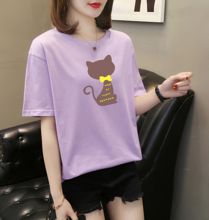 a woman wearing a purple shirt with a mouse on it